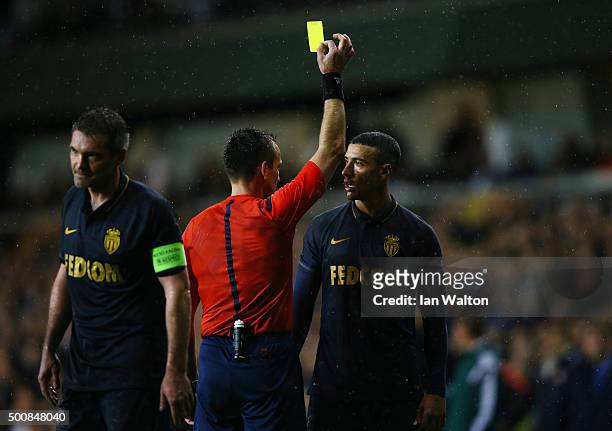 Nabil Dirar of Monaco is shown the yellow card by referee Ivan Bebek of Croatia for dissent during the UEFA Europa League Group J match between...