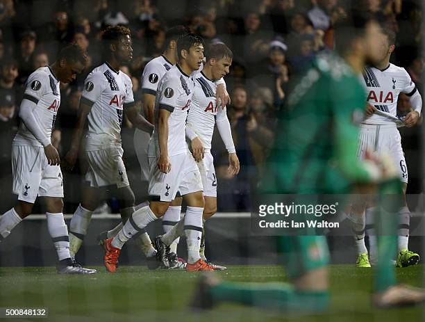 Tom Carroll of Spurs is congratulated by teammates after scoring his team's fourth goal and his first for the club during the UEFA Europa League...