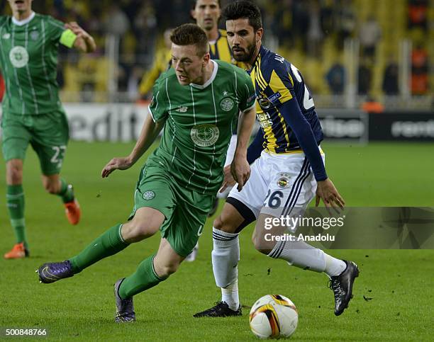 Alper Potuk of Fenerbahce vies for the ball with Callum McGregor of Celtic during the UEFA Europa League Group A soccer match between Fenerbahce SK...