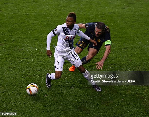 Clinton Njie of Tottenham Hotspur FC is tackled by Jeremy Toulalan of AS Monaco FC during the UEFA Europa League group J match between Tottenham...