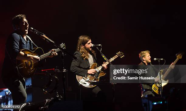 Marcus Mumford, Winston Marshall and Ted Dwane of Mumford & Sons performs live on stage at The O2 Arena on December 10, 2015 in London, England.