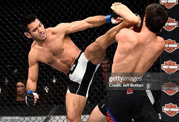 Phillipe Nover kicks Zubaira Tukhugov in their featherweight bout during the UFC Fight Night event at The Chelsea at the Cosmopolitan of Las Vegas on...