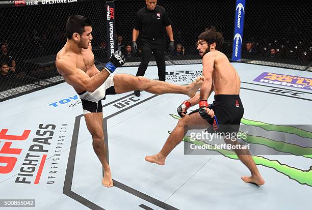 Phillipe Nover kicks Zubaira Tukhugov in their featherweight bout during the UFC Fight Night event at The Chelsea at the Cosmopolitan of Las Vegas on...