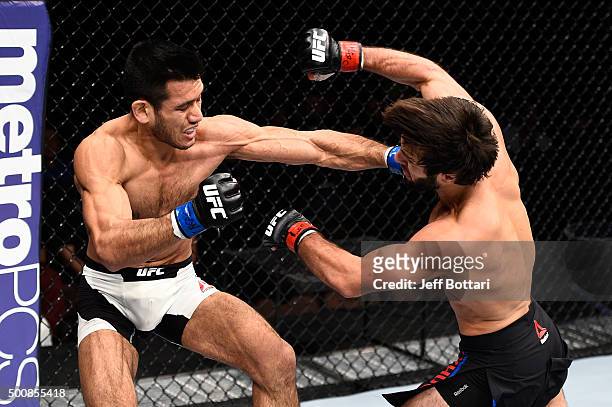 Phillipe Nover punches Zubaira Tukhugov in their featherweight bout during the UFC Fight Night event at The Chelsea at the Cosmopolitan of Las Vegas...