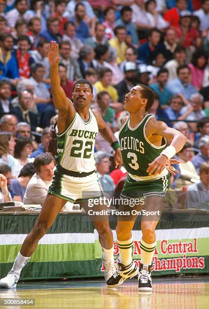 Dennis Johnson of the Boston Celtics guards Ricky Pierces of the Milwaukee Bucks during an NBA basketball game circa 1986 at the MECCA Arena in...