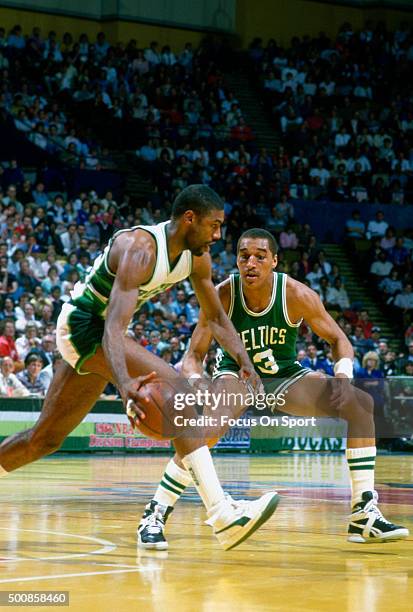 Dennis Johnson of the Boston Celtics guards Paul Pressey of the Milwaukee Bucks during an NBA basketball game circa 1986 at the MECCA Arena in...