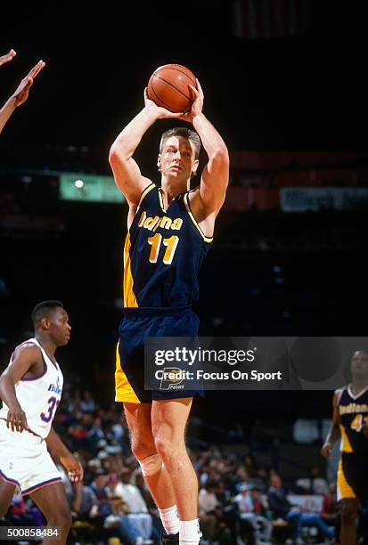 Detlef Schrempf of the Indiana Pacers looks to pass the ball against the Washington Bullets during an NBA basketball game circa 1992 at the Capital...