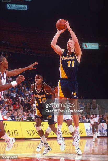 Detlef Schrempf of the Indiana Pacers shoots against the Washington Bullets during an NBA basketball game circa 1990 at the Capital Centre in...