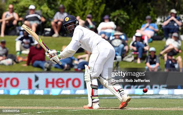 Dinesh Chandimal of Sri Lanka guides the ball through fine-leg during day two of the First Test match between New Zealand and Sri Lanka at University...