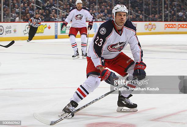 David Clarkson of the Columbus Blue Jackets keeps an eye on the play during first period action against the Winnipeg Jets at the MTS Centre on...