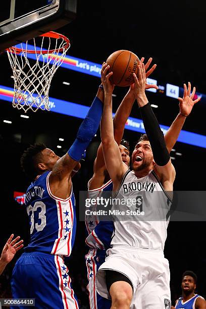Andrea Bargnani of the Brooklyn Nets drives to the net against Robert Covington of the Philadelphia 76ers at Barclays Center on December 10, 2015 in...