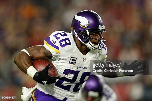 Running back Adrian Peterson of the Minnesota Vikings runs with the football during the first half of the NFL game against the Minnesota Vikings at...