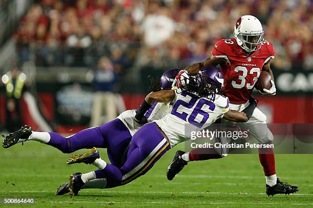 Running back Kerwynn Williams of the Arizona Cardinals rushes the football against cornerback Trae Waynes of the Minnesota Vikings during the second...