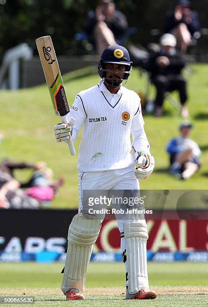 Dinesh Chandimal of Sri Lanka acknowledges the crowd after scoring 50 runs during day two of the First Test match between New Zealand and Sri Lanka...