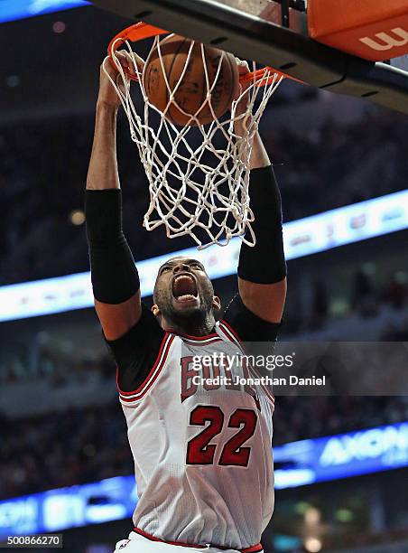 Taj Gibson of the Chicago Bulls dunks against the Los Angeles Clippers at the United Center on December 10, 2015 in Chicago, Illinois. The Bulls...