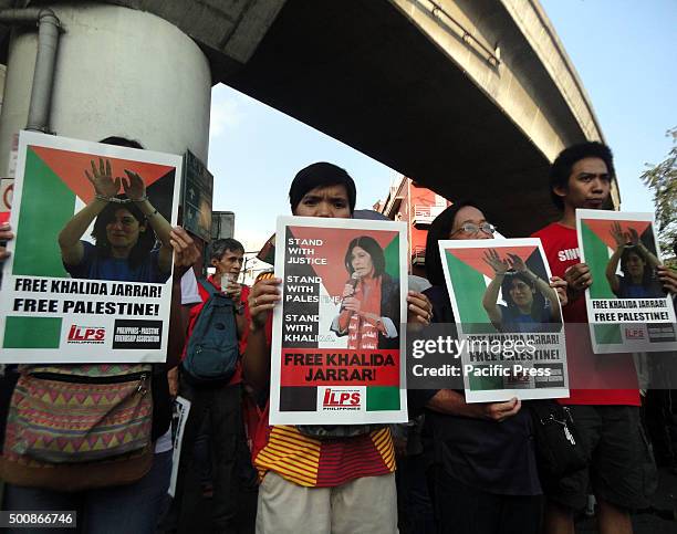 Filipino protesters hold placards calling to release Palestinian activist Khalida Jarrar during a protest marking International Human Rights Day in...