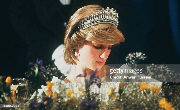 Diana, Princess of Wales, wearing a cream satin dress by Gina Fratini with the Queen Mary Tiara, attends a banquet at Hotel Nova Scotian on June 15,...