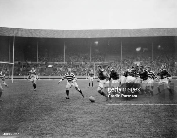 Wigan player fails to hold a pass during the first Challenge Cup Final, between Wigan and Dewsbury, at Wembley Stadium, London, 4th May 1929. Wigan...