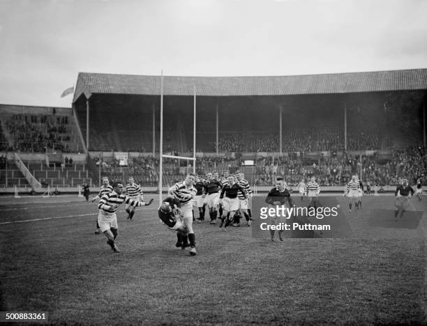 Wigan player tackles an opponent during the first Challenge Cup Final, between Wigan and Dewsbury, at Wembley Stadium, London, 4th May 1929. Wigan...