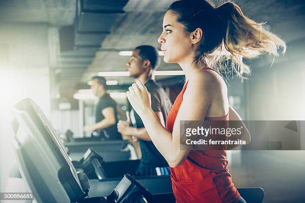 diverse people running on treadmill - sports training stock pictures, royalty-free photos & images