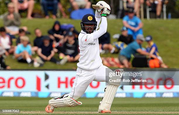 Dinesh Chandimal of Sri Lanka drives through cover for 4 during day two of the First Test match between New Zealand and Sri Lanka at University Oval...