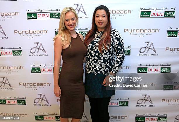 Paige Spiranac of the United States with Shanshan Feng of China during the welcome party at the Puro Beach Pool area at the Jebel Ali Golf Spa Resort...