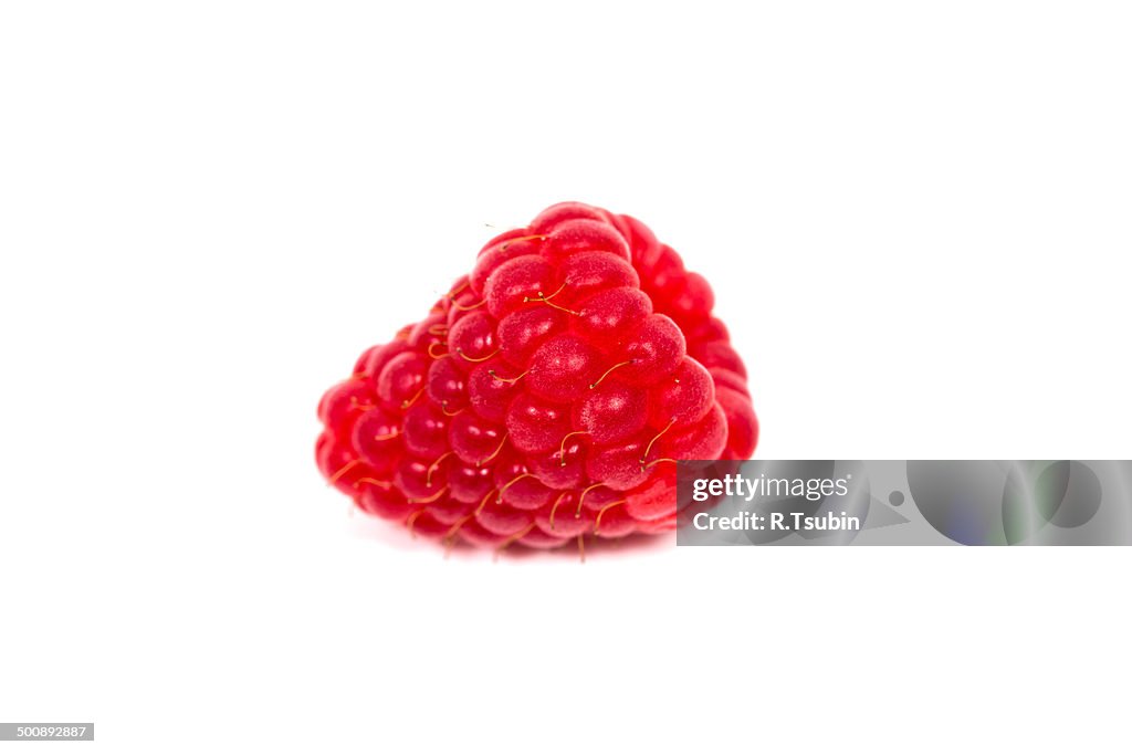 Ripe red raspberry isolated on white background