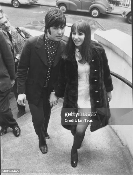 Singers Esther and Abi Ofarim arriving at their hotel in Britain, circa 1965.