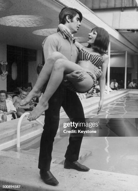 Singers Esther and Abi Ofarim, posing next to a swimming pool on a visit to Munich, Germany, June 3rd 1965.