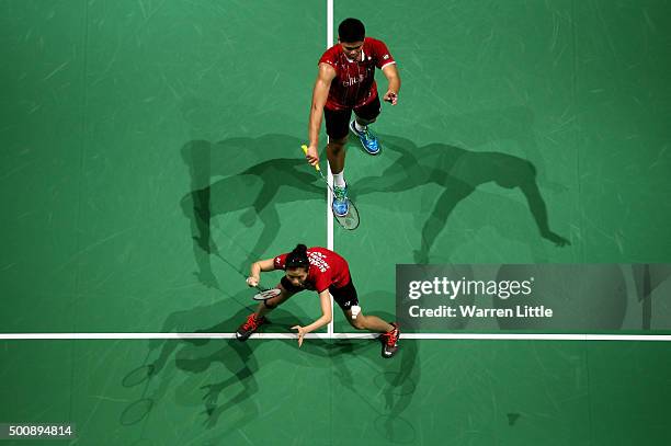 Praveen Jordan and Debby Susanto of Indonesia in action against Joachim Fischer Nielsen and Christinna Pedersen of Denmark during day three of the...