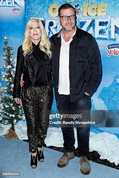 Tori Spelling and Dean McDermott arrive to the premiere of Disney On Ice's "Frozen" at Staples Center on December 10, 2015 in Los Angeles, California.