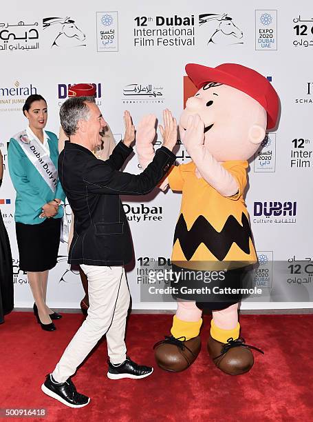 Director Steve Martino and character Charlie Brown attend "The Peanuts Movie" premiere during day three of the 12th annual Dubai International Film...