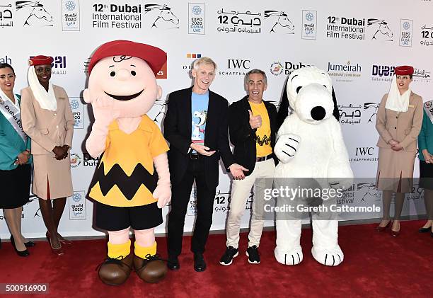 Character Charlie Brown, writer and director Craig Schulz, director Steve Martino and character Snoopy attend "The Peanuts Movie" premiere during day...