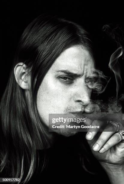 Kid Rock, studio portrait, smoking cigar, United Kingdom, 1998.