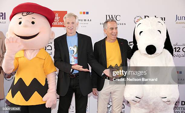 Character Charlie Brown, writer and director Craig Schulz, director Steve Martino and character Snoopy attend "The Peanuts Movie" premiere during day...