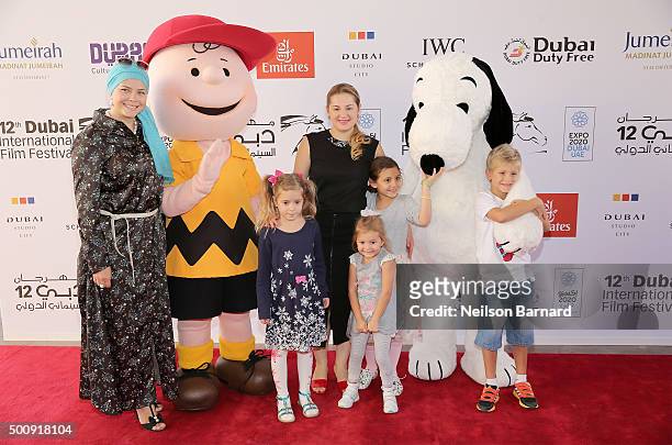 Characters Charlie Brown and Snoopy with guests as they attend "The Peanuts Movie" premiere during day three of the 12th annual Dubai International...