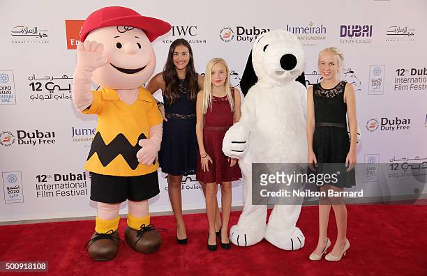 Characters Charlie Brown and Snoopy with guests as they attend "The Peanuts Movie" premiere during day three of the 12th annual Dubai International...