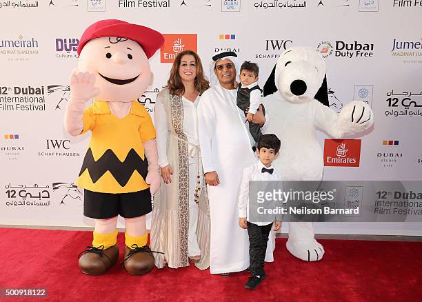 Character Charlie Brown, DIFF Chairman Abdulhamid Juma, character Snoopy and guests attend "The Peanuts Movie" premiere during day three of the 12th...