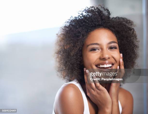 smooth skin puts a smile on her face - toothy smile stock pictures, royalty-free photos & images