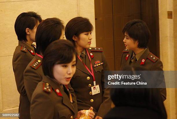 Members of the Moranbong Band, await departure from their hotel for a rehearsal on December 11, 2015 in Beijing, China. The Moranbong band will...