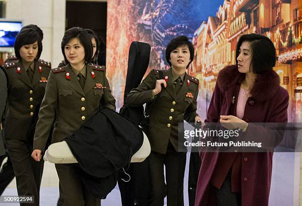 Members of the North Korean State Merited Chorus and the Moranbong Band, two famous North Korean performance groups, arrive at their hotel on...