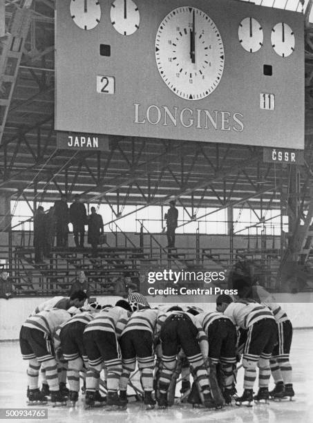 The Japanese Ice Hockey team gathers together to discuss tactics during the match against Czechoslovakia at the Winter Olympics, Innsbruck, Austria,...