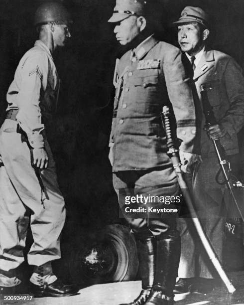 Imperial Japanese Army General General Torashiro Kawabe carrying his samurai sword arrives in Manila to surrender to the U.S. Army, Philippines, 31st...