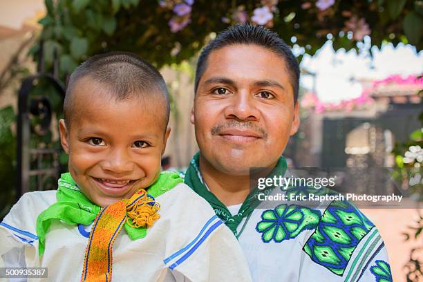 wixaritari boy with father in traditional dress - huichol fotografías e imágenes de stock