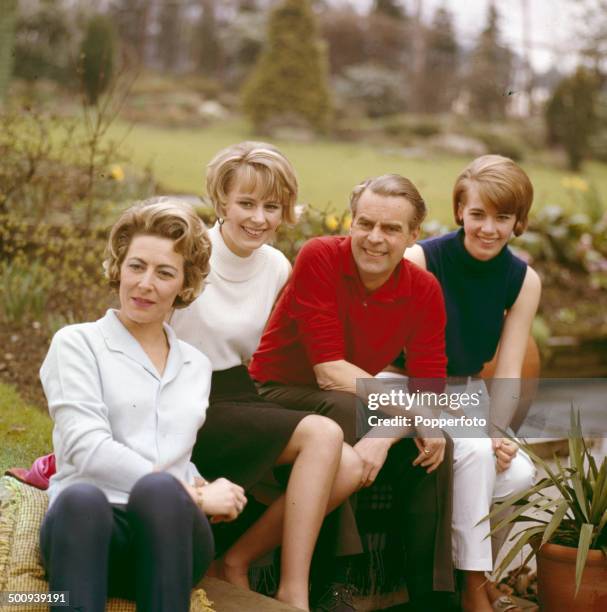 English actor Ian Carmichael pictured with his wife Jean McLean and daughters Lee and Sally at home in 1966.