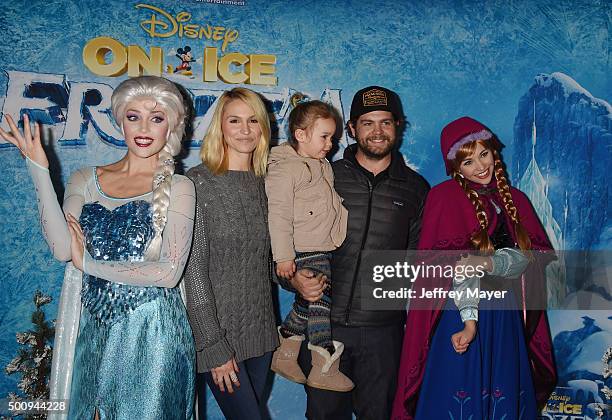 Elsa the Snow Queen, Lisa Osbourne, Pearl Osbourne, Jack Osbourne and Princess Anna arrive at the premiere of Disney On Ice's 'Frozen' at Staples...