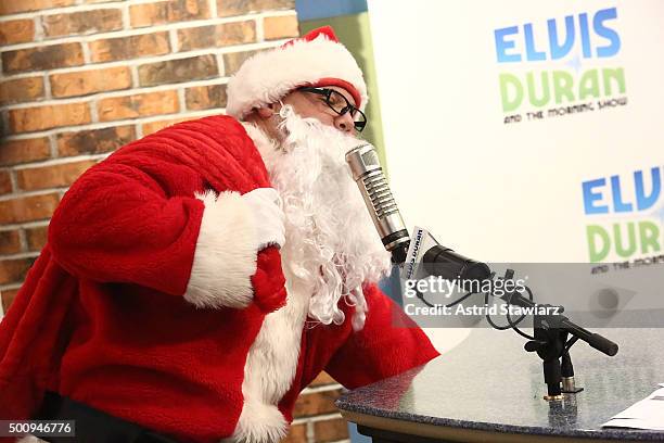 Host Greg T wears a Santa suit during "The Elvis Duran Z100 Morning Show" at Z100 Studios on December 11, 2015 in New York City.