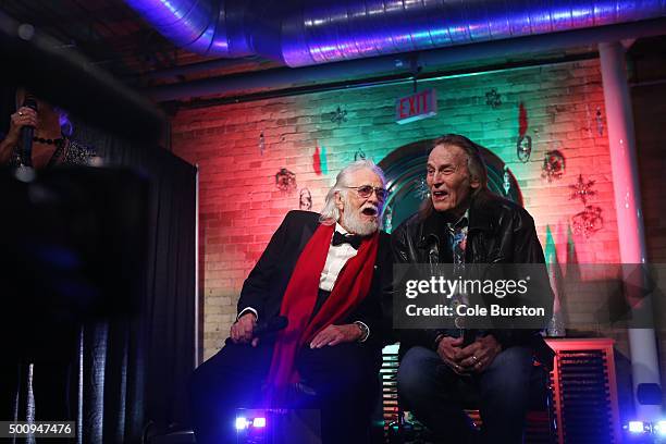 Legendary Canadian musicians Gordon Lightfoot, right, and Ronnie Hawkins, answer questions on stage, during the launch of their new collaboration of...