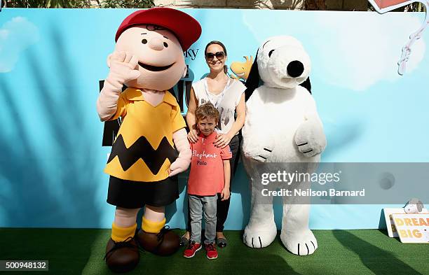 Characters Charlie Brown and Snoopy with guests as they attend "The Peanuts Movie" premiere during day three of the 12th annual Dubai International...