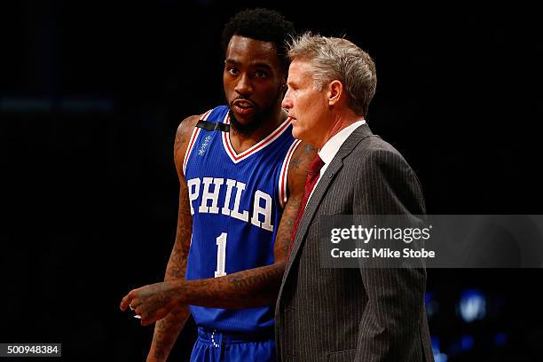 Brett Brown of the Philadelphia 76ers speaks with Tony Wroten during the game against the Brooklyn Nets at Barclays Center on December 10, 2015 in...